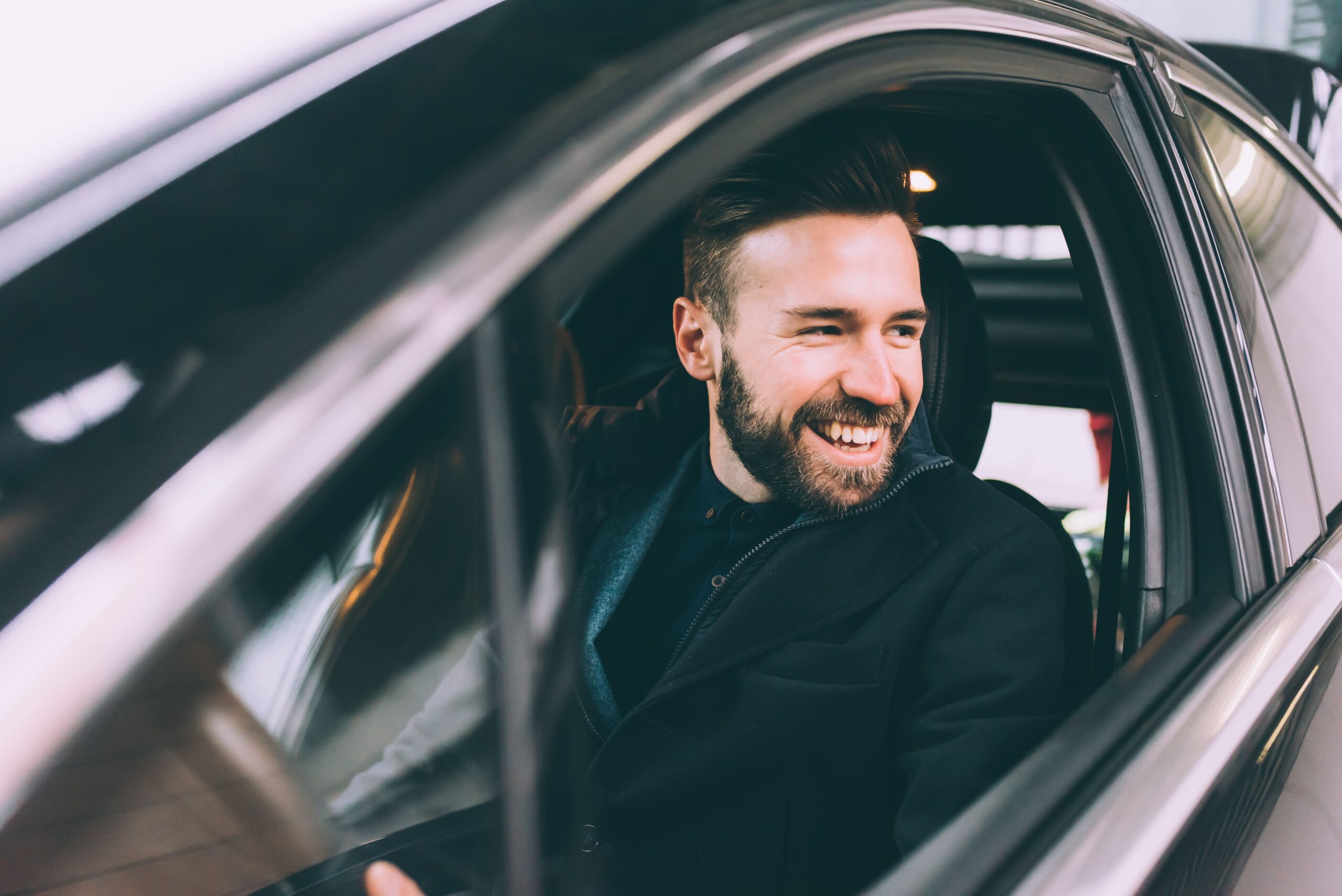 young-bearded-businessman-sitting-car-2022-01-28-21-51-18-utc-min